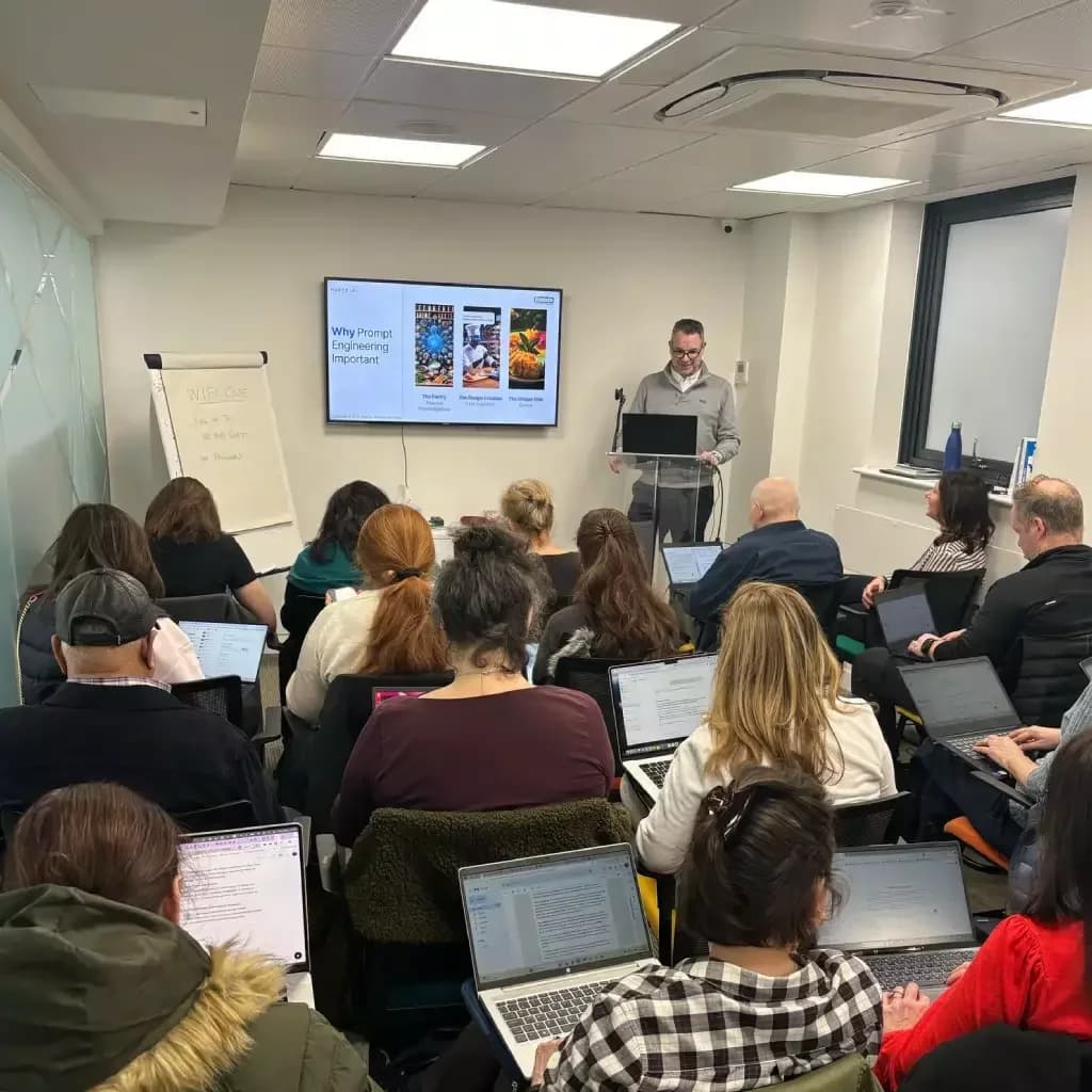 Live Hartz AI training session with UK SME team members collaborating around a table