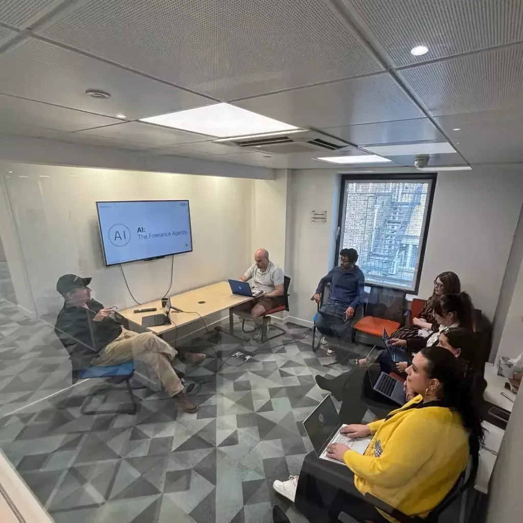 Small-group AI training workshop led by Hartz AI, with participants learning practical and safe AI skills in a real business setting.